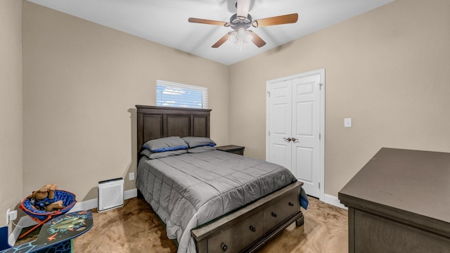 bedroom featuring ceiling fan and a closet