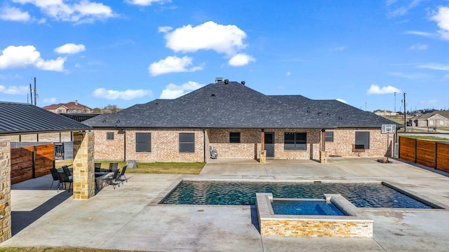 view of swimming pool with an in ground hot tub, an outdoor bar, and a patio