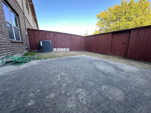 view of yard with a patio area and central air condition unit