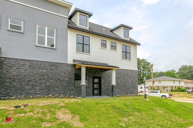 view of front facade with a front yard