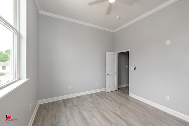 empty room with ceiling fan, ornamental molding, and light hardwood / wood-style flooring