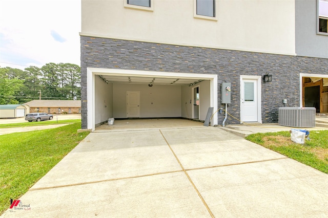 exterior space featuring central AC unit and a lawn