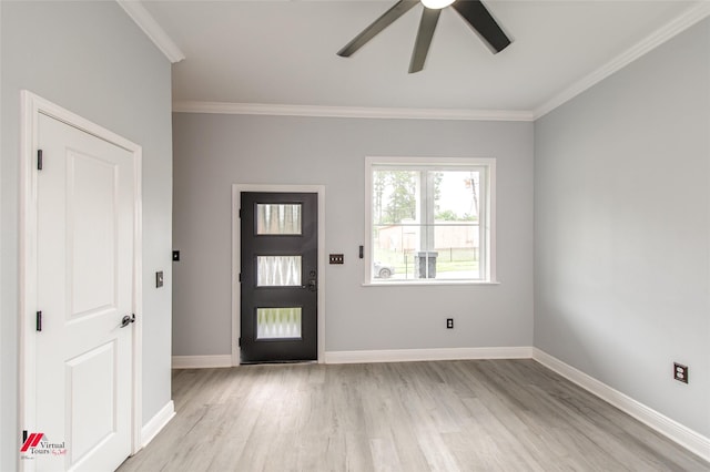 entryway featuring ornamental molding, ceiling fan, and light wood-type flooring