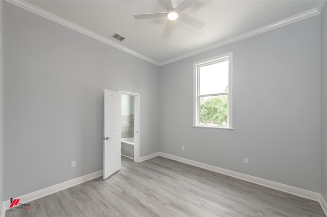 empty room featuring ornamental molding, light hardwood / wood-style floors, and ceiling fan