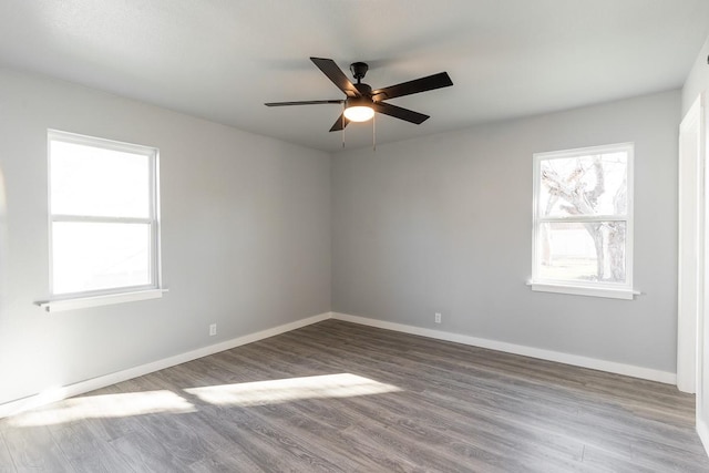 unfurnished room featuring ceiling fan and hardwood / wood-style floors