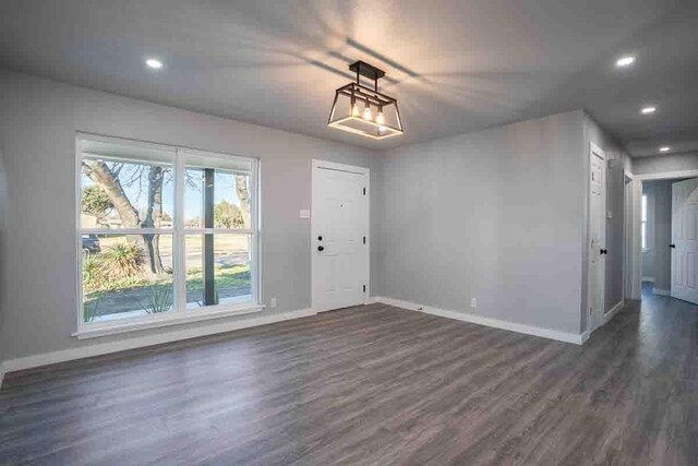 foyer entrance with dark hardwood / wood-style floors