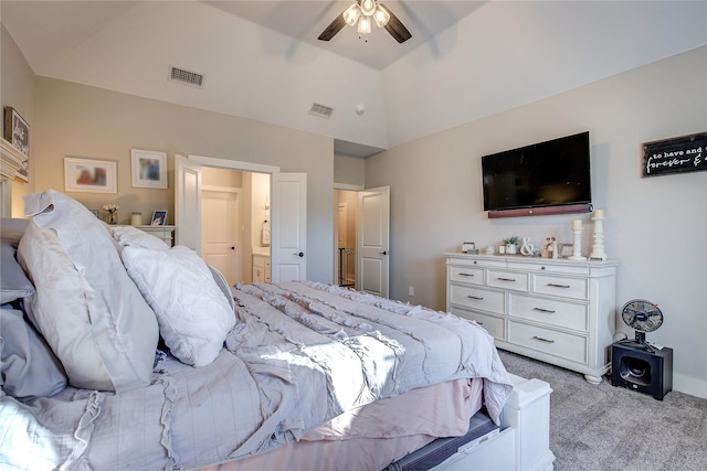 carpeted bedroom featuring ceiling fan and vaulted ceiling