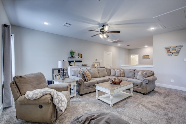 living room with ceiling fan and light colored carpet