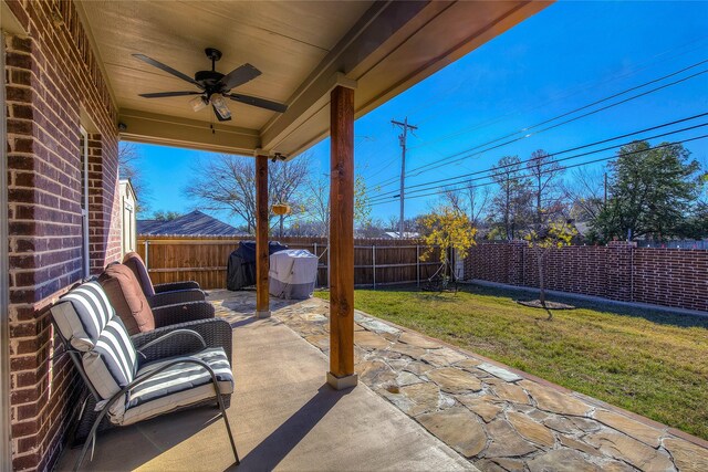 view of patio / terrace featuring ceiling fan