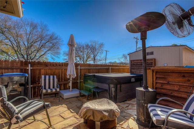 view of patio / terrace with a hot tub