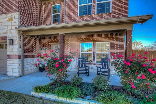 view of patio featuring a porch