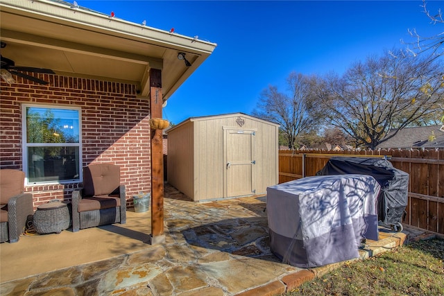 view of patio with a storage shed