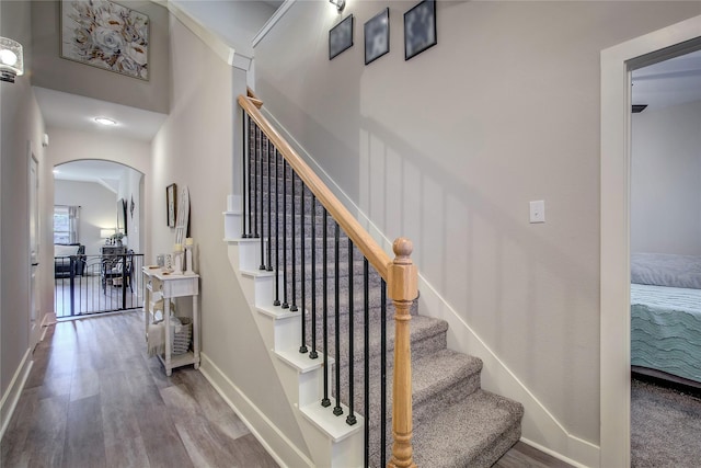 stairway featuring wood-type flooring