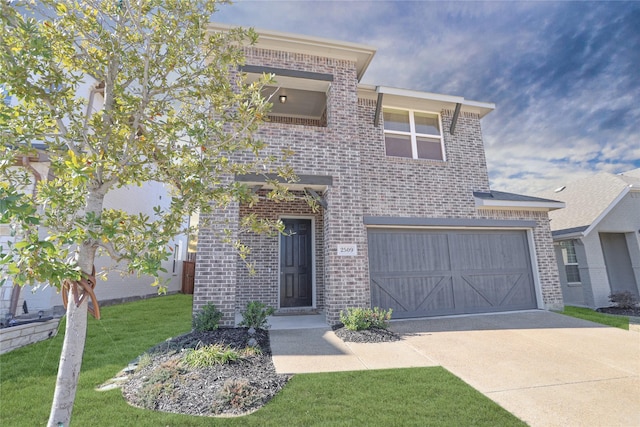 view of front facade with a garage and a front yard