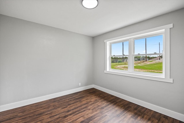 empty room featuring dark wood-type flooring