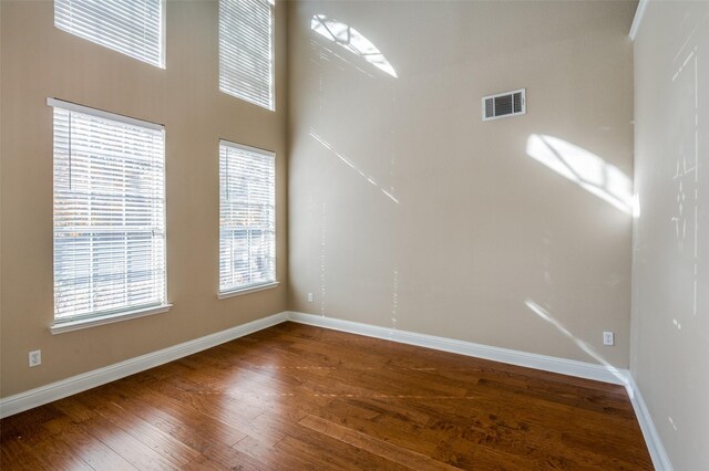 unfurnished living room featuring hardwood / wood-style flooring