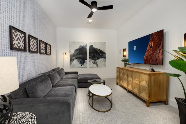 carpeted living room featuring ceiling fan