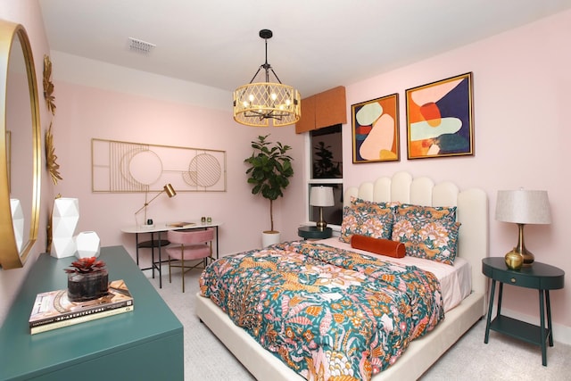 carpeted bedroom featuring a notable chandelier