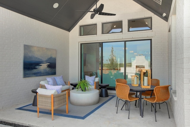 view of patio / terrace featuring a fireplace and ceiling fan