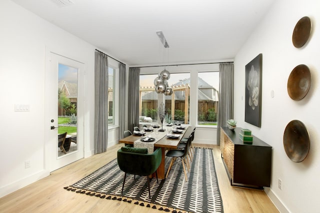 sunroom with a chandelier