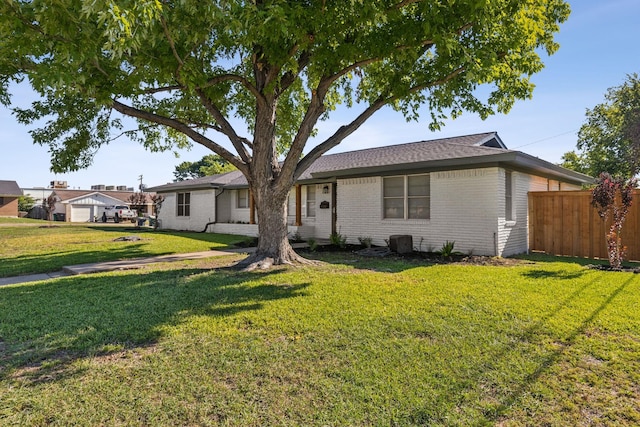 single story home featuring a front yard