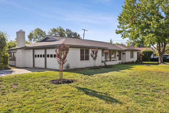 ranch-style home with a front yard and a garage