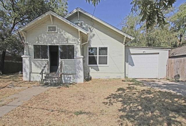 bungalow-style home with a garage