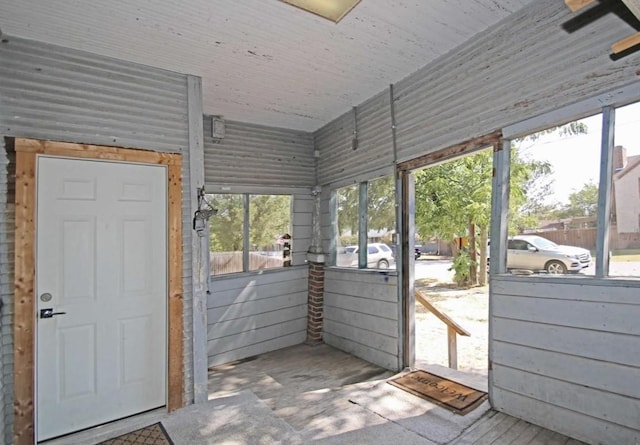 unfurnished sunroom featuring a healthy amount of sunlight