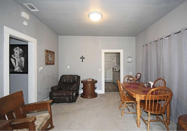 dining space with carpet flooring