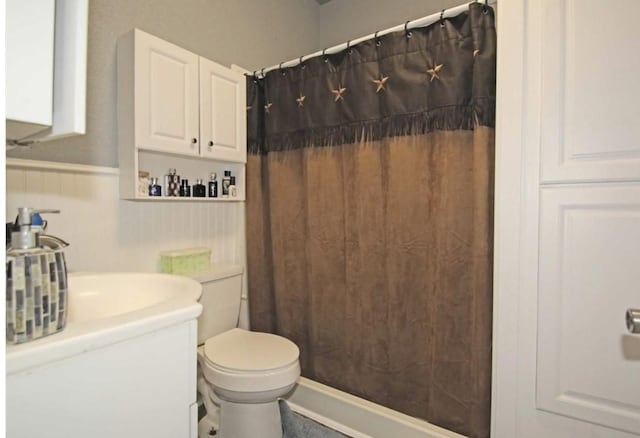 bathroom with a shower with curtain and toilet