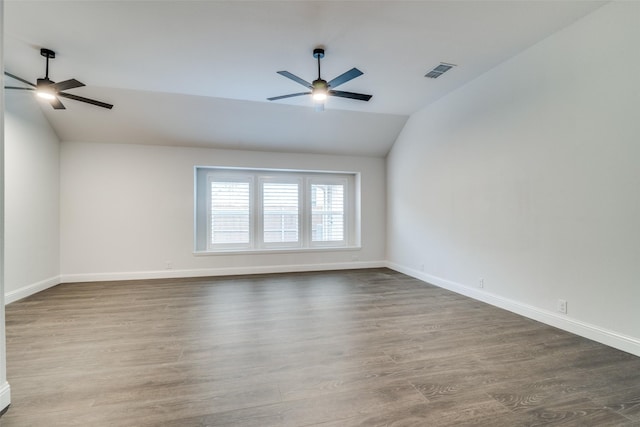 unfurnished room with ceiling fan, visible vents, and wood finished floors