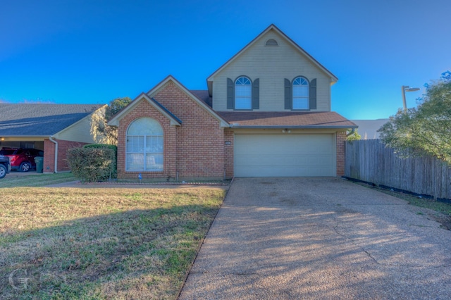 front facade featuring a front yard and a garage