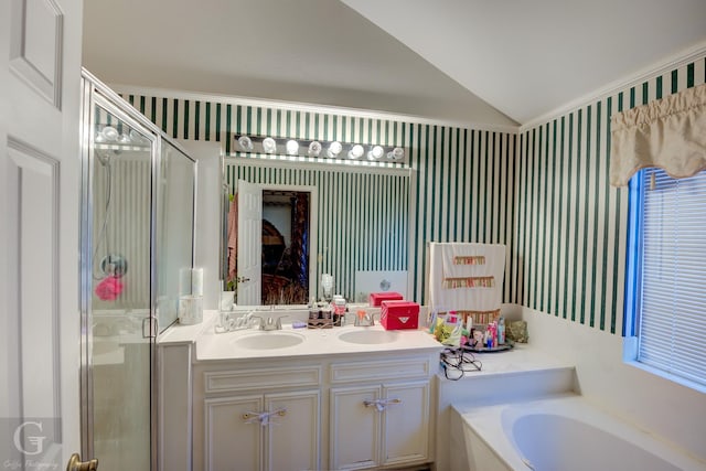 bathroom with separate shower and tub, vanity, and lofted ceiling