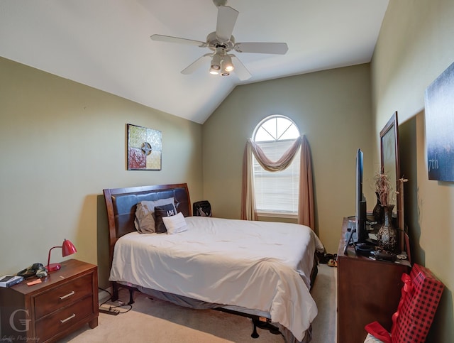 carpeted bedroom featuring ceiling fan and vaulted ceiling