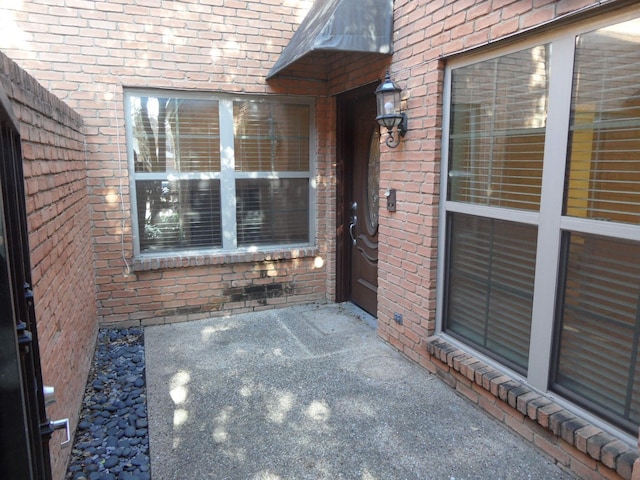 doorway to property with a patio area