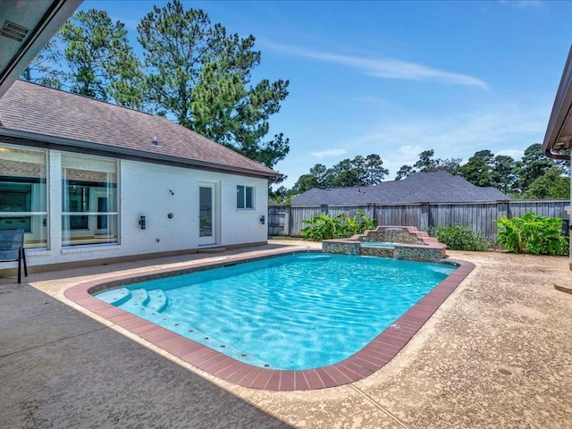 view of swimming pool with a fenced in pool, a fenced backyard, a patio, and a jacuzzi