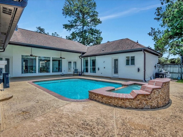 view of pool featuring french doors, a patio area, fence, and ceiling fan