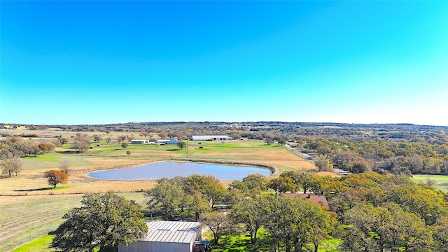 birds eye view of property featuring a rural view and a water view