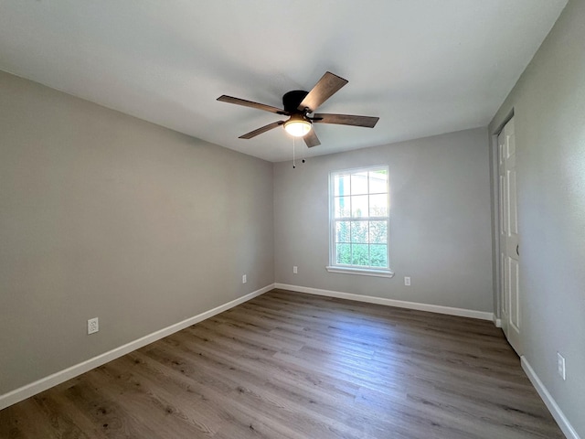 spare room featuring ceiling fan and light hardwood / wood-style flooring