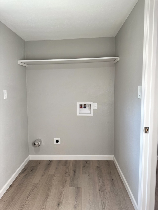 laundry area with hookup for a washing machine, light wood-type flooring, and hookup for an electric dryer