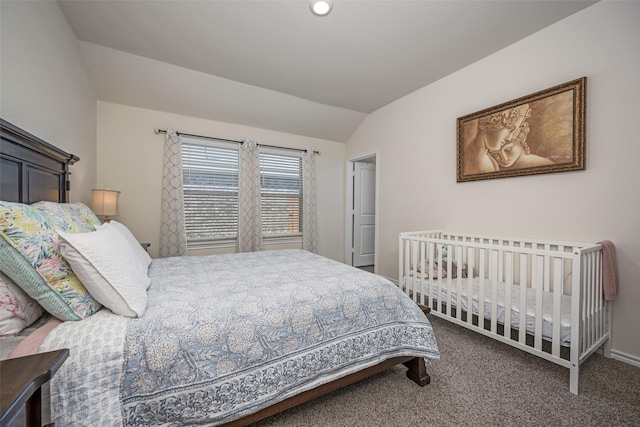 carpeted bedroom featuring vaulted ceiling