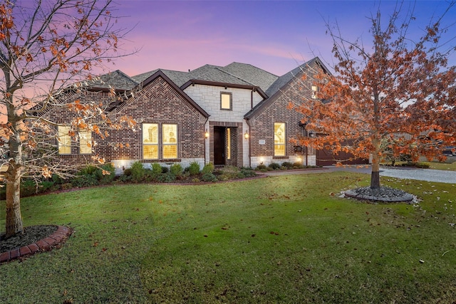 view of front of home with a lawn