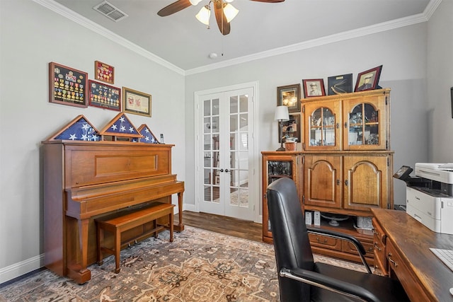 home office featuring crown molding, dark hardwood / wood-style flooring, ceiling fan, and french doors