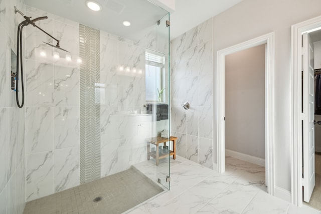 bathroom with tiled shower