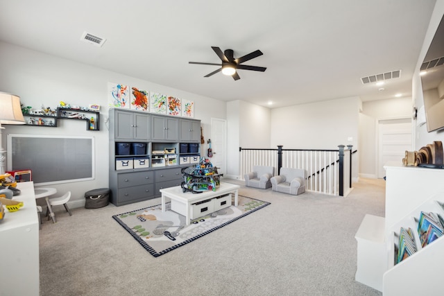 living room with light carpet and ceiling fan