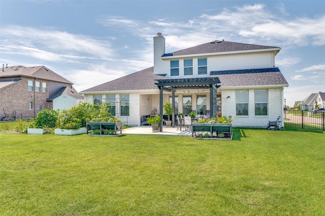 back of property featuring a yard, a pergola, and a patio