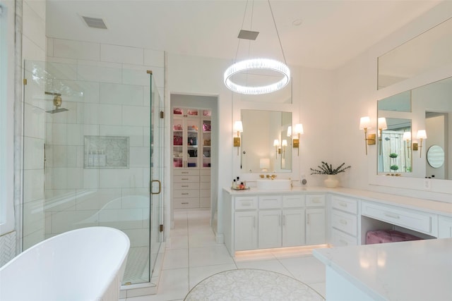 bathroom with vanity, tile patterned floors, and separate shower and tub