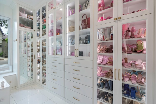 spacious closet featuring light tile patterned floors