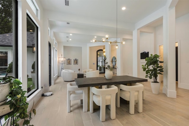 dining room with a chandelier, visible vents, recessed lighting, and light wood-type flooring