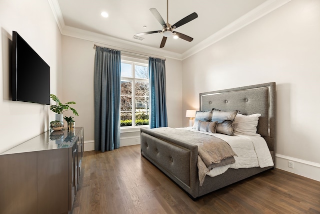 bedroom featuring ornamental molding, dark hardwood / wood-style floors, and ceiling fan